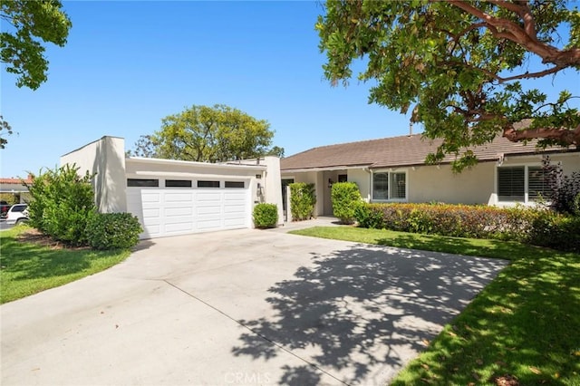 403 Vista Parada, Newport Beach, CA 92660 - view of front facade featuring stucco siding, concrete driveway, an attached garage, and a front lawn