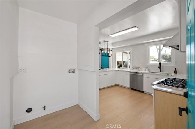 2321 W 182nd St, Torrance, CA 90504 - kitchen featuring appliances with stainless steel finishes, light wood-type flooring, light countertops, and white cabinetry