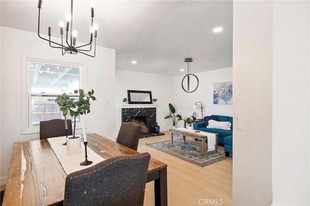 2321 W 182nd St, Torrance, CA 90504 - dining area with wood finished floors, a chandelier, a fireplace, and recessed lighting