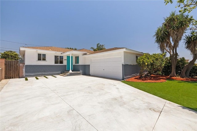 2321 W 182nd St, Torrance, CA 90504 - ranch-style house featuring stucco siding, an attached garage, and driveway