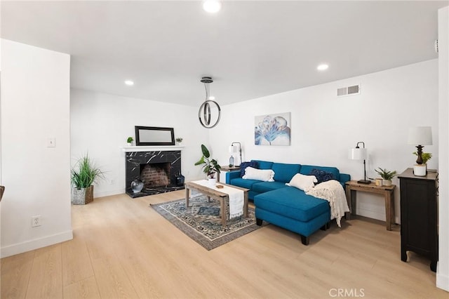 2321 W 182nd St, Torrance, CA 90504 - living room featuring light wood finished floors, a high end fireplace, and recessed lighting