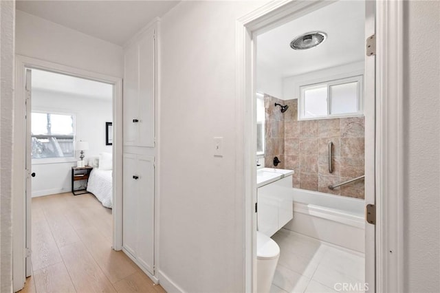 2321 W 182nd St, Torrance, CA 90504 - ensuite bathroom with bathtub / shower combination, vanity, healthy amount of natural light, and wood finished floors