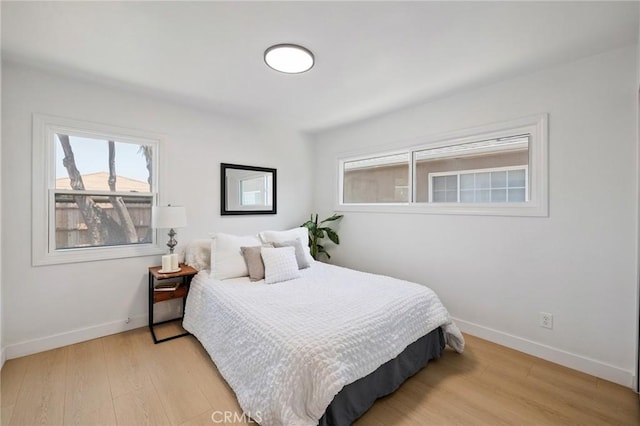 2321 W 182nd St, Torrance, CA 90504 - bedroom with multiple windows and light wood-style flooring