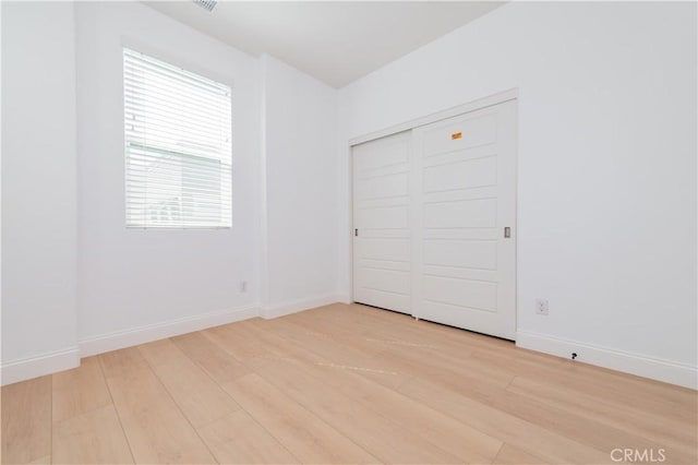 9570 Bluewater Pl, Rancho Cucamonga, CA 91730 - unfurnished bedroom featuring light wood-style floors and a closet