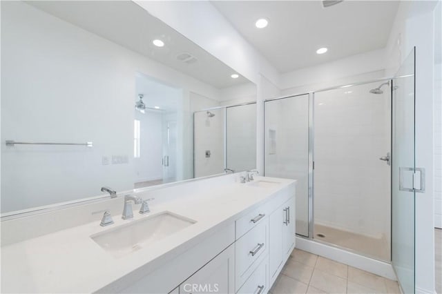 9570 Bluewater Pl, Rancho Cucamonga, CA 91730 - full bathroom featuring a shower stall, double vanity, tile patterned floors, and recessed lighting