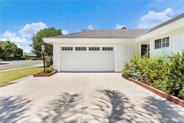 11752 Pine St, Los Alamitos, CA 90720 - view of front of house with concrete driveway and an attached garage