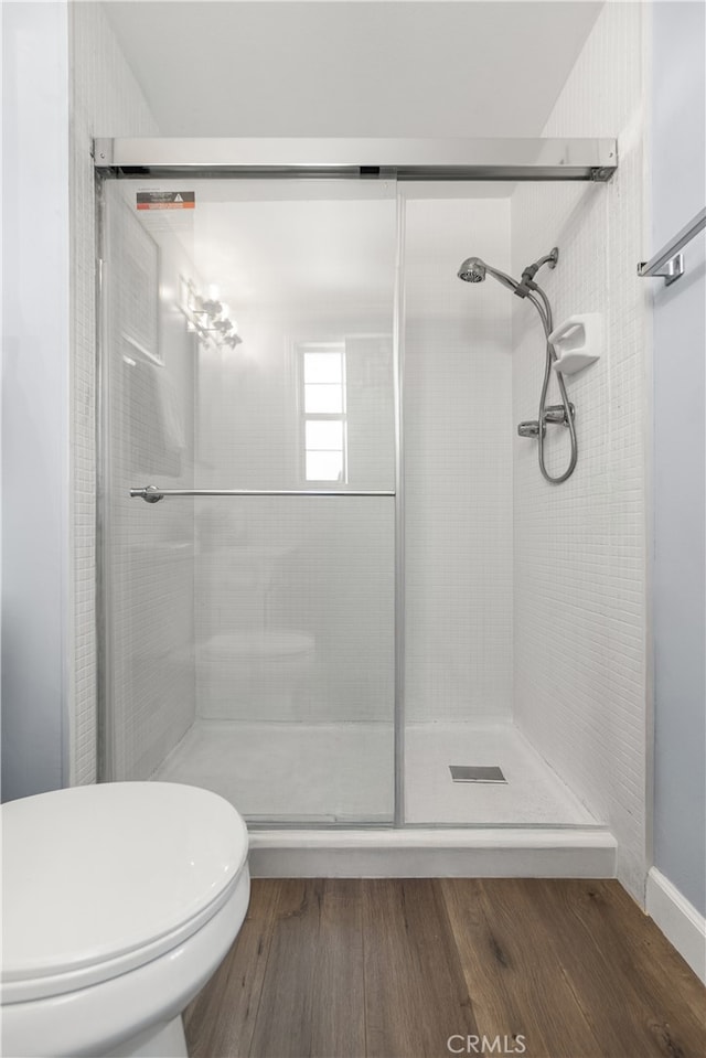 11752 Pine St, Los Alamitos, CA 90720 - bathroom with a shower with shower door and wood finished floors