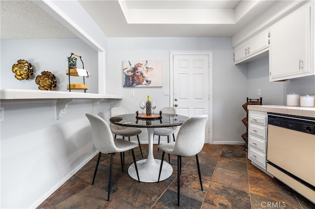 11752 Pine St, Los Alamitos, CA 90720 - dining room with stone tile flooring and a raised ceiling
