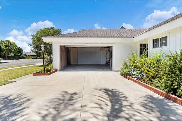 11752 Pine St, Los Alamitos, CA 90720 - view of side of property featuring driveway and an attached garage