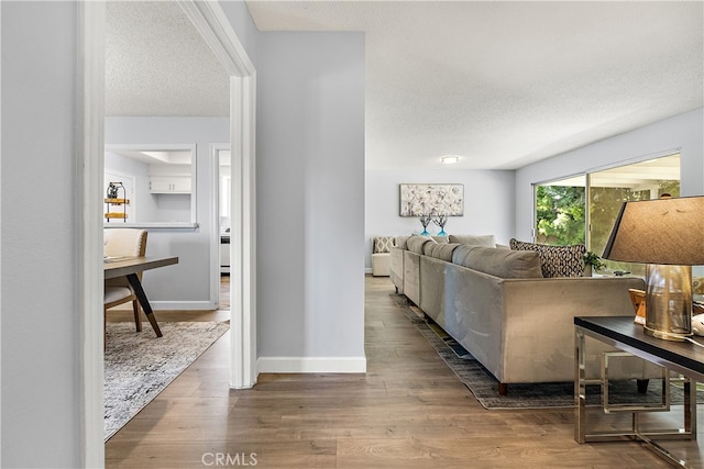 11752 Pine St, Los Alamitos, CA 90720 - living room featuring wood finished floors and a textured ceiling