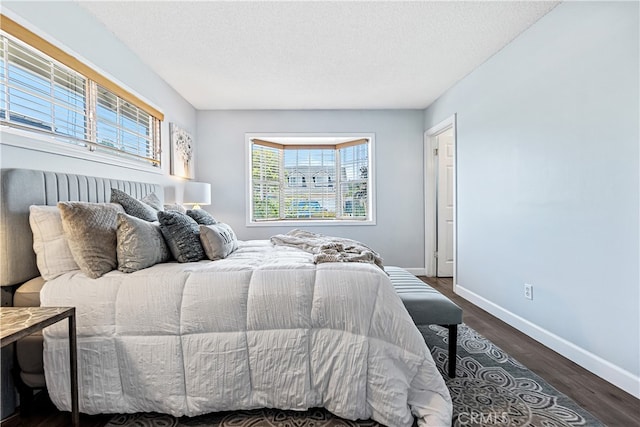 11752 Pine St, Los Alamitos, CA 90720 - bedroom with dark wood-type flooring and a textured ceiling