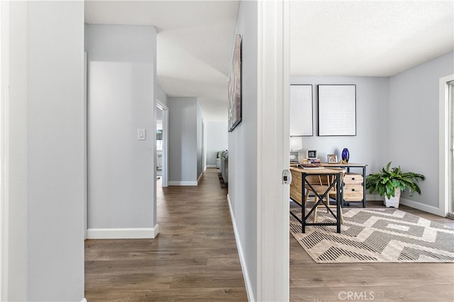 11752 Pine St, Los Alamitos, CA 90720 - hall with wood finished floors, an office area, and a textured ceiling