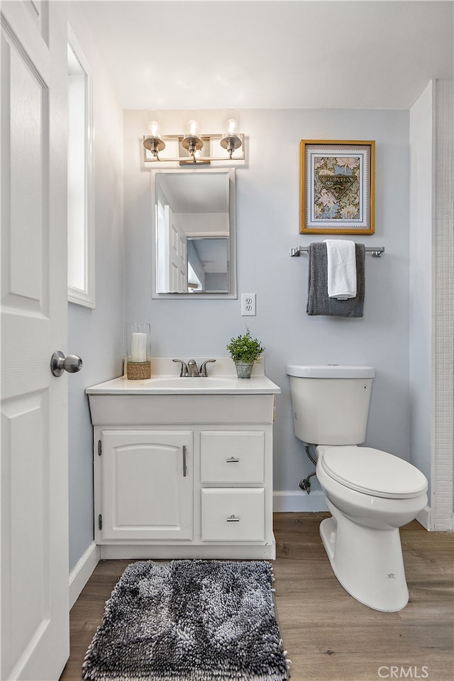 11752 Pine St, Los Alamitos, CA 90720 - half bathroom with vanity and wood finished floors