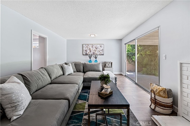 11752 Pine St, Los Alamitos, CA 90720 - living area with wood finished floors and a textured ceiling