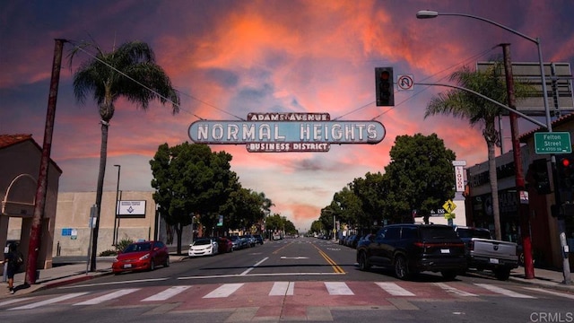 3050 Suncrest Dr Unit 7, San Diego, CA 92116 - view of asphalt road featuring street lights, sidewalks, traffic signs, and curbs