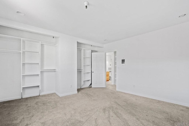 3050 Suncrest Dr Unit 7, San Diego, CA 92116 - unfurnished bedroom with carpet flooring and two closets