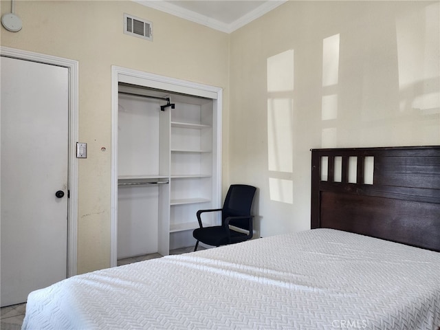 4312 Walton Ave, Los Angeles, CA 90037 - bedroom with crown molding and a closet