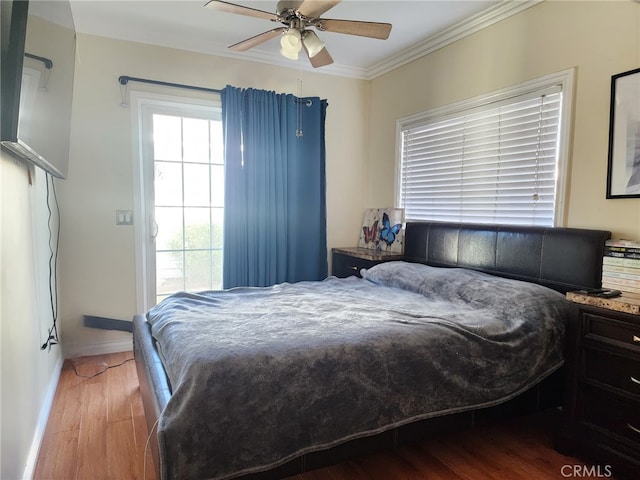 4312 Walton Ave, Los Angeles, CA 90037 - bedroom featuring wood finished floors, crown molding, and ceiling fan