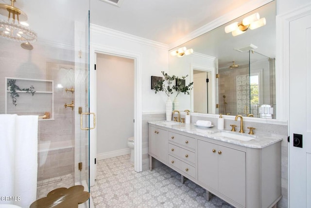 1036 S Madison Ave, Pasadena, CA 91106 - bathroom with double vanity, a shower stall, crown molding, and tile patterned floors