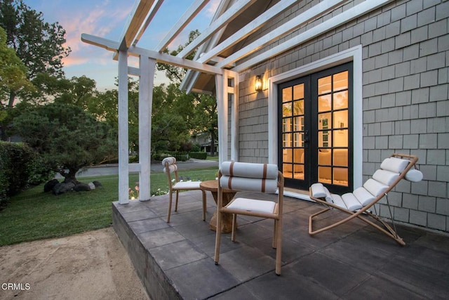 1036 S Madison Ave, Pasadena, CA 91106 - patio terrace at dusk with french doors, a pergola, a yard, and a patio area