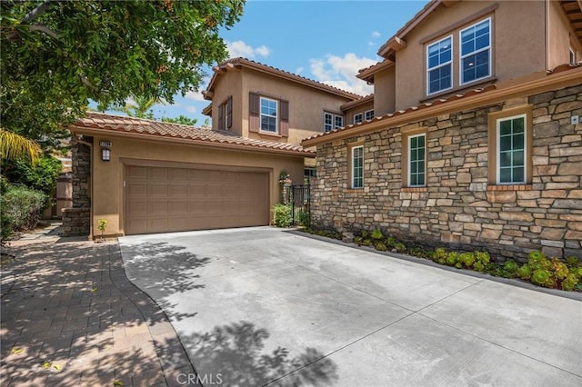 17286 Coriander Ct, Yorba Linda, CA 92886 - view of front of house featuring stone siding, stucco siding, concrete driveway, and an attached garage