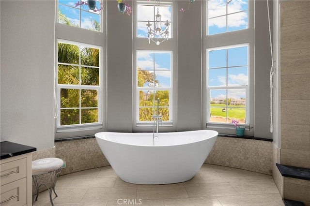 17286 Coriander Ct, Yorba Linda, CA 92886 - full bathroom featuring a freestanding bath, healthy amount of natural light, a chandelier, and a towering ceiling