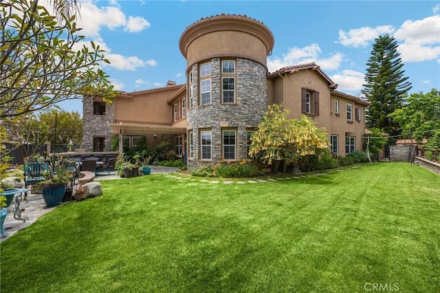 17286 Coriander Ct, Yorba Linda, CA 92886 - back of property with stone siding, stucco siding, and a patio area