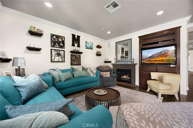 17286 Coriander Ct, Yorba Linda, CA 92886 - living room featuring ornamental molding, recessed lighting, a glass covered fireplace, and wood finished floors
