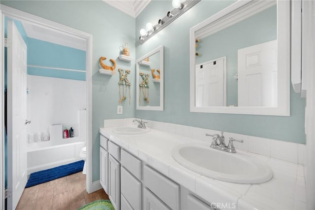 17286 Coriander Ct, Yorba Linda, CA 92886 - bathroom featuring double vanity, wood finished floors, ornamental molding, and bathing tub / shower combination