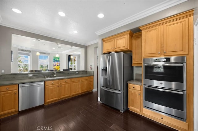 17286 Coriander Ct, Yorba Linda, CA 92886 - kitchen with appliances with stainless steel finishes, dark countertops, crown molding, recessed lighting, and dark wood-style flooring