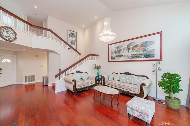 10 La Quinta Unit 21, Irvine, CA 92612 - living room featuring stairs, high vaulted ceiling, wood finished floors, a chandelier, and recessed lighting