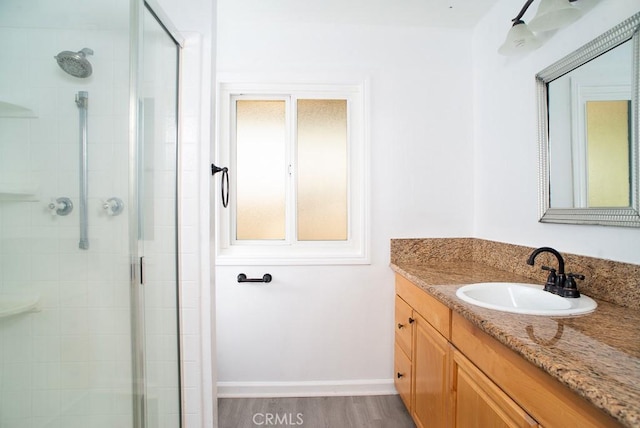 8131 Canby Ave Unit 5, Reseda, CA 91335 - full bath featuring vanity, a shower stall, and wood finished floors