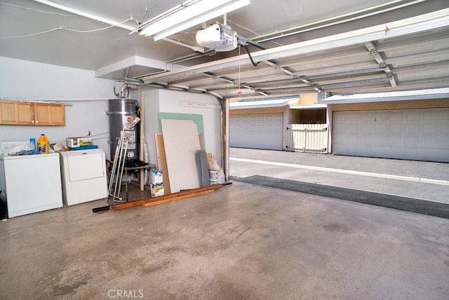 8131 Canby Ave Unit 5, Reseda, CA 91335 - garage with independent washer and dryer, strapped water heater, and a garage door opener
