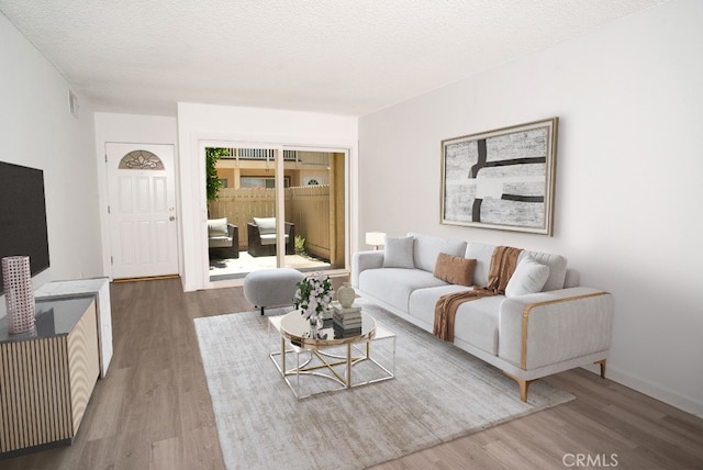 8131 Canby Ave Unit 5, Reseda, CA 91335 - living room featuring wood finished floors and a textured ceiling
