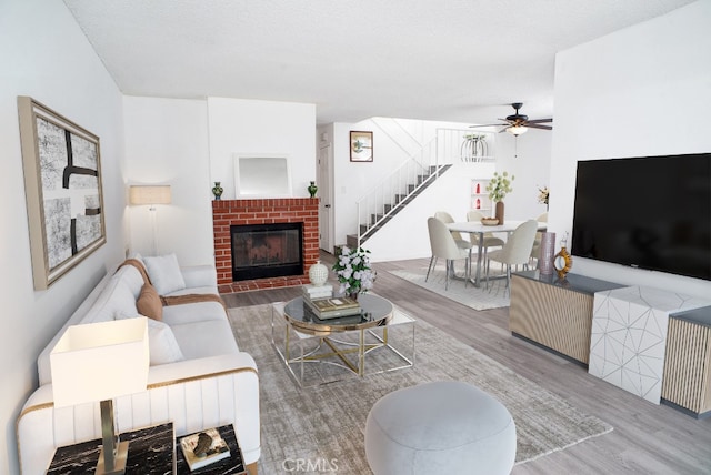 8131 Canby Ave Unit 5, Reseda, CA 91335 - living area with wood finished floors, stairs, ceiling fan, and a fireplace