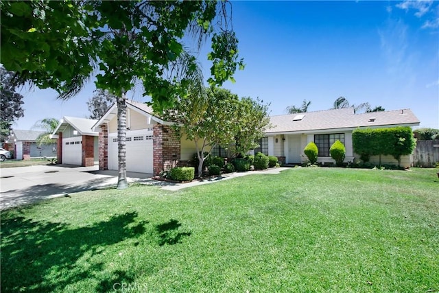 24409 Dunlavy Ct, Moreno Valley, CA 92557 - view of front of property featuring driveway, a garage, a front yard, and brick siding