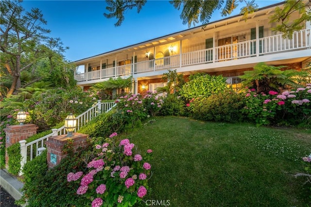 3541 Westfall Dr, Encino, CA 91436 - view of front of property with a balcony and a front yard