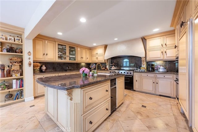 3541 Westfall Dr, Encino, CA 91436 - kitchen with custom exhaust hood, high end range, cream cabinetry, a center island, and recessed lighting