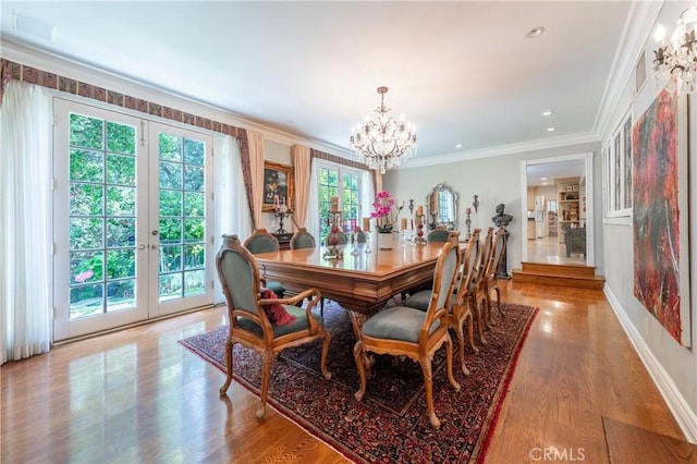 3541 Westfall Dr, Encino, CA 91436 - dining space featuring french doors, a chandelier, crown molding, and light wood-type flooring