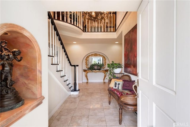 3541 Westfall Dr, Encino, CA 91436 - foyer featuring a chandelier, light tile patterned floors, stairs, and a high ceiling