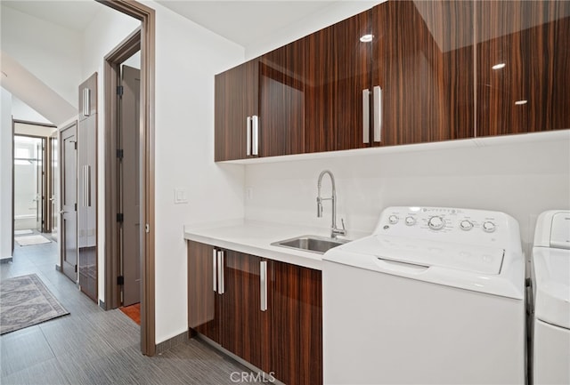 2623 Carnegie Ln, Redondo Beach, CA 90278 - laundry room with cabinet space and independent washer and dryer