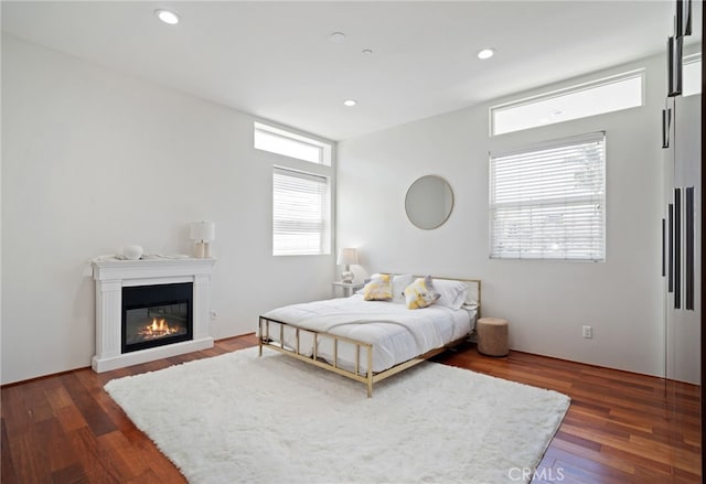 2623 Carnegie Ln, Redondo Beach, CA 90278 - bedroom with dark wood-style floors, a glass covered fireplace, and recessed lighting