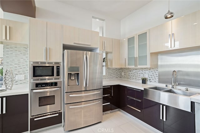 2623 Carnegie Ln, Redondo Beach, CA 90278 - kitchen featuring appliances with stainless steel finishes, light countertops, tasteful backsplash, and modern cabinets