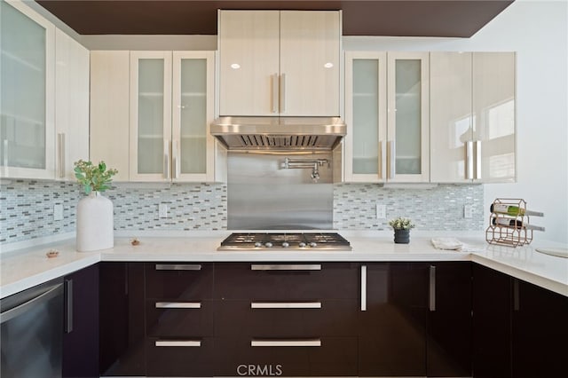 2623 Carnegie Ln, Redondo Beach, CA 90278 - kitchen featuring under cabinet range hood, light countertops, stainless steel appliances, and white cabinets
