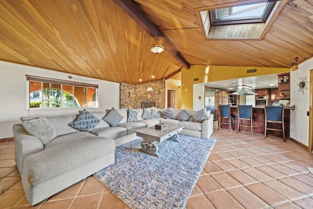 3204 Via Caliente Del Sol, Jamul, CA 91935 - living room with wooden ceiling, a skylight, and light tile patterned floors