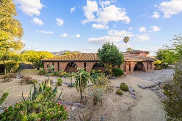 3204 Via Caliente Del Sol, Jamul, CA 91935 - back of property featuring a tile roof and a mountain view