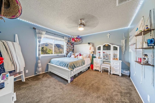3204 Via Caliente Del Sol, Jamul, CA 91935 - bedroom featuring carpet, a textured ceiling, and ceiling fan