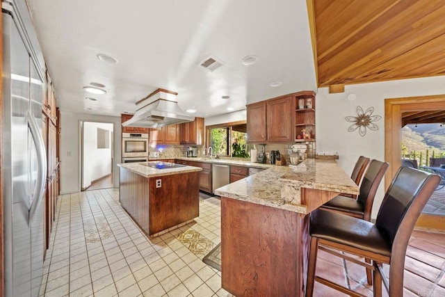 3204 Via Caliente Del Sol, Jamul, CA 91935 - kitchen featuring stainless steel appliances, a peninsula, open shelves, ventilation hood, and tasteful backsplash