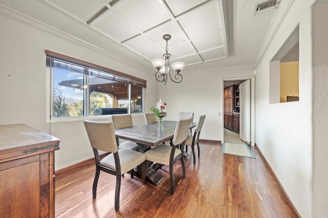 3204 Via Caliente Del Sol, Jamul, CA 91935 - dining space featuring coffered ceiling, wood finished floors, a chandelier, and ornamental molding