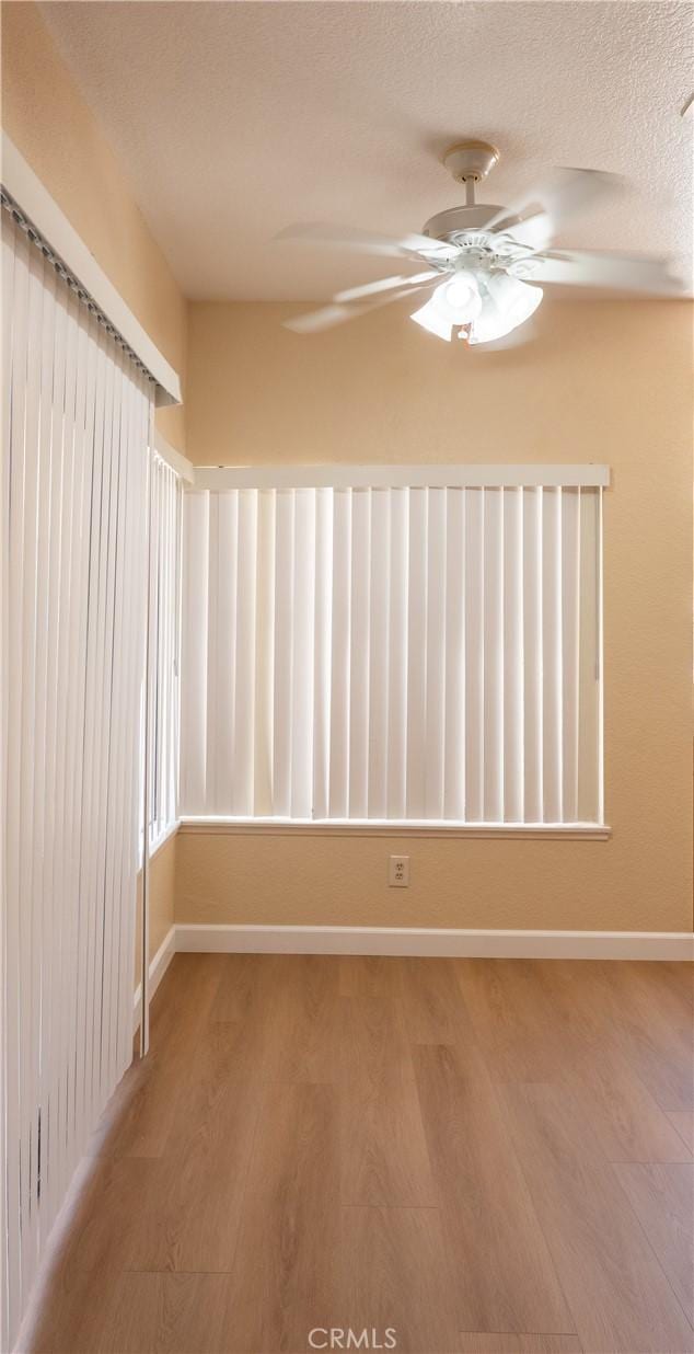 22760 Mountain View Rd, Moreno Valley, CA 92557 - empty room with wood finished floors and a ceiling fan